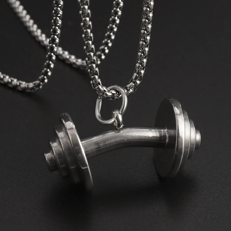 Fashionable dumbbell necklace designed for muscle men, perfect for sports and fitness. It's a great couple's gift and fits well with hip hop gym trends. Ideal jewelry for fitness lovers!